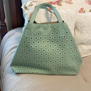 Light green lazer cut leather like bag
